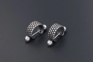 Retro silver punk rock titanium steel stud earrings with grainy textured ball detail
