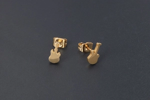 Detailed macro view of 24K gold plated guitar shaped titanium steel stud earrings