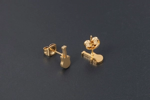 Detailed macro view of gold-plated titanium guitar-shaped stud earrings with butterfly backs