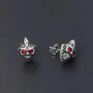 Gothic punk skull stud earrings in silver steel with red stone eyes and flame detail