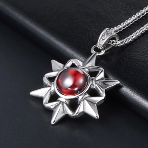 Vintage gothic star pendant necklace with red gem on black leather background