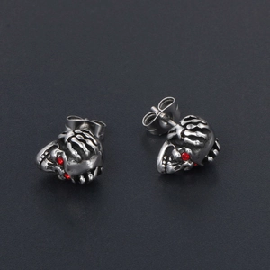 Boucles d'oreilles crâne gothiques en acier inoxydable avec yeux rouges en cristal