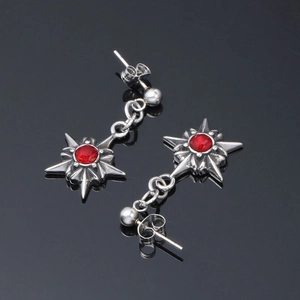 Boucles d'oreilles punk en acier inoxydable avec étoile et cristal rouge sur fond noir