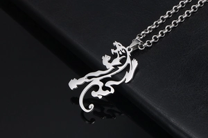Macro detail of silver hollow dragon totem pendant with heavy link metal chain
