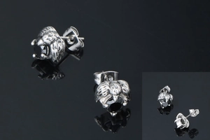 Detailed close-up of eagle claw stud earrings with black onyx stones and vintage finish