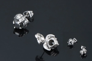 Macro view of vintage silver dragon claw stud earring with black onyx stone setting