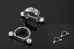 Detailed close-up of chunky braided silver twist design nipple rings with mirror polish finish