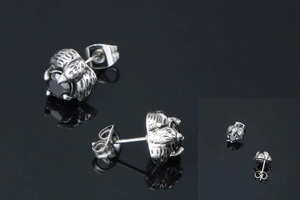 Close-up of gothic eagle claw earrings featuring black onyx stones and vintage finish
