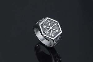Macro detail of hexagonal titanium steel signet ring with crossed arrow engraving