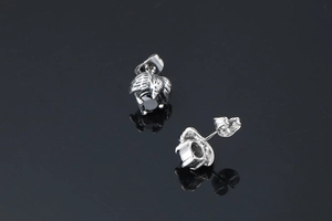 Detailed view of Gothic raven claw earrings with faceted black onyx and retro silver finish