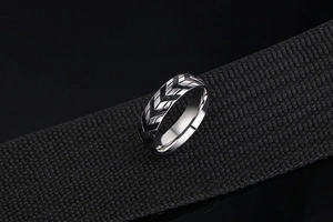 Macro shot of silver tire tread pattern on titanium steel ring with industrial design