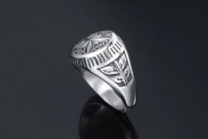 Detail shot of vintage star pattern engraved on a stainless steel signet ring for men