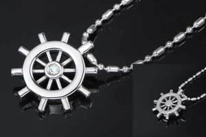 Detailed front and back view of a nautical ship wheel pendant with a central rhinestone