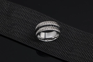 Detailed view of punk style titanium steel ring with chain texture and black stones