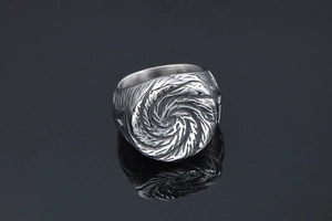 Macro view of vintage titanium steel wide ring featuring bold whirlpool texture