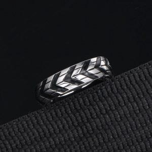Men's titanium steel ring with black and silver tire tread pattern for industrial style