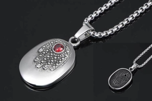 Macro view of vintage Hand of Fatima pendant with red ruby and honeycomb back texture