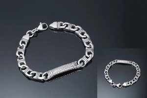 Close-up of punk stainless steel chain bracelet with a textured diamond pattern plate