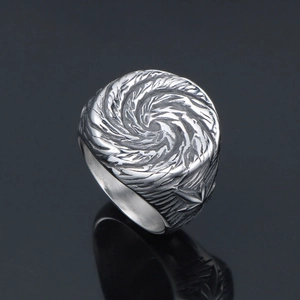 Punk style titanium steel signet ring featuring a silver vortex textured round surface