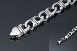 Detailed close-up of stainless steel anchor chain with intricate twisted rope engravings