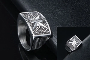 Macro view of the octagonal star relief and beaded texture on a punk steel men's ring