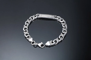 Detail shot of men's stainless steel totem bracelet with lobster clasp and textured plate