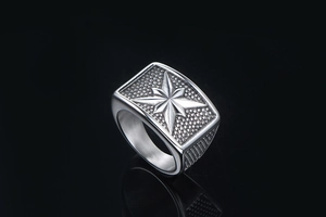 Close-up of vintage punk octagram star ring with textured rectangular face