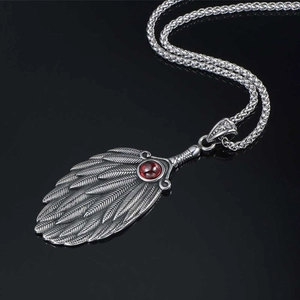Vintage wing pendant necklace in silver finish with a red gemstone and wheat chain