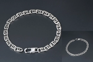 Detailed shot of silver titanium steel chain bracelet with geometric hollow patterns