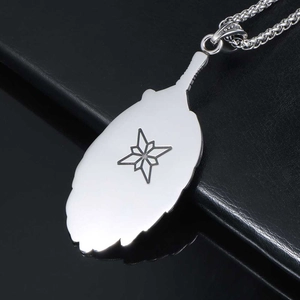Polished silver feather pendant necklace with compass star engraving on black leather base
