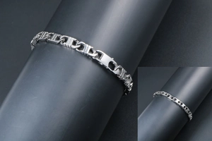 Macro shot of silver anchor chain link bracelet with polished stainless steel finish