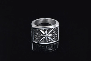 Detailed view of punk style star compass relief on a vintage silver men's ring