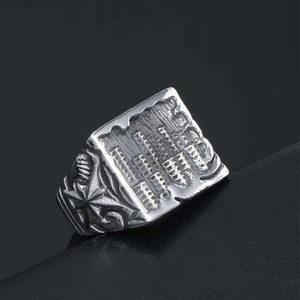 Retro stainless steel signet ring with embossed text and radial star side patterns