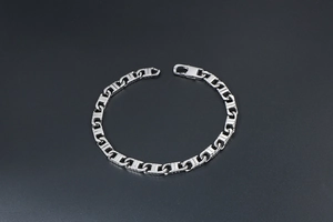 Detail showing polished rectangular link chain with classic lobster clasp closure