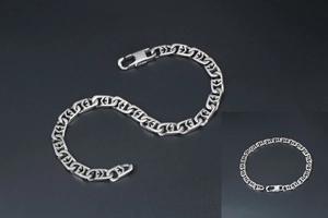 Close-up of silver titanium steel chain bracelet with geometric links and secure clasp
