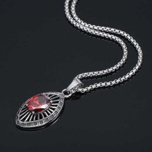 Titanium steel necklace featuring a teardrop red zircon pendant with mesh frame design