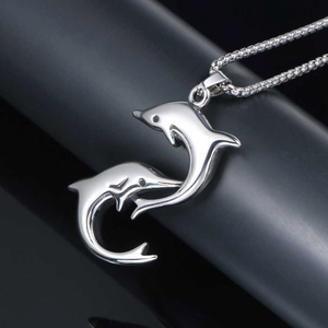 Minimalist stainless steel playful double dolphin pendant with a stylish box chain necklace