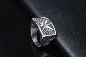 Macro shot of punk style stainless steel ring with embossed eight-pointed star detail