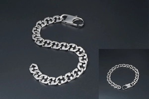 Detail of chunky silver titanium steel chain bracelet with a heavy lobster clasp