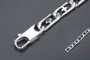 Detail view of titanium steel bracelet featuring hollow cross links and lobster clasp