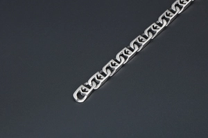 Detailed macro view of interlocking silver titanium steel chain links with polished finish