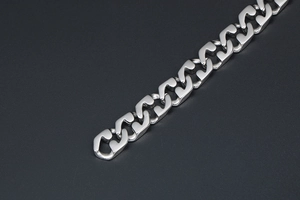 Close-up of industrial style silver titanium steel chain links with geometric design