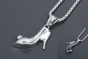 Detailed view of silver stiletto high heel pendant with polished finish on box chain