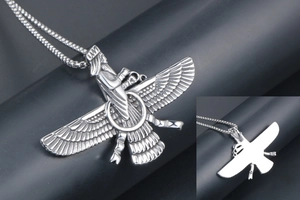 Macro detail of Faravahar pendant showing intricate wing texture and smooth reverse side