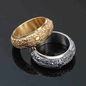 Vintage fidget ring set in gold and silver stainless steel with rotary relief patterns