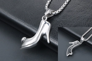 Macro shot of silver high heel pendant necklace with polished finish and box chain