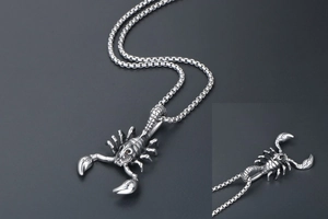 Detailed close-up of a punk-style titanium steel scorpion pendant with a box chain