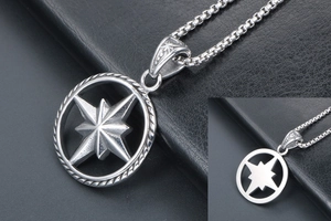 Close-up of punk compass star pendant featuring front and back metal craft details