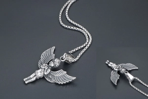 Detail view of vintage silver guardian angel pendant and box chain necklace for men