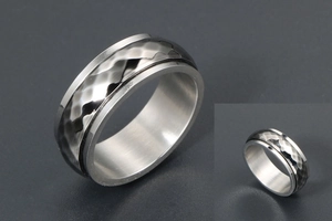 Detailed view of wide industrial steel ring featuring hammered texture and brushed finish